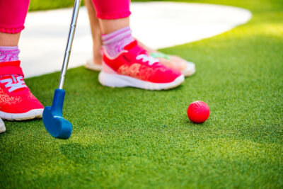 Miniature,Golf,Outdoor.,Little,Caucasian,Girl,Golfing,In,The,Mini
